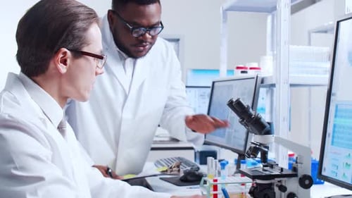 Scientists Collaborate on Medical Research in Laboratory