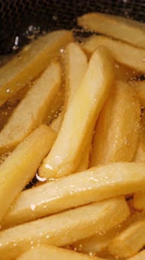 Golden French Fries Deep Frying Close Up