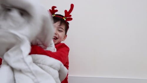 Playful Children Enjoy Blanket Fight During Christmas