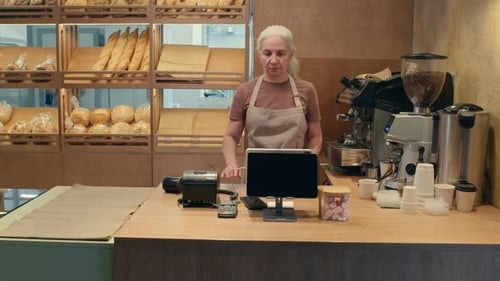 Portrait of Senior Woman at Work in Bakery
