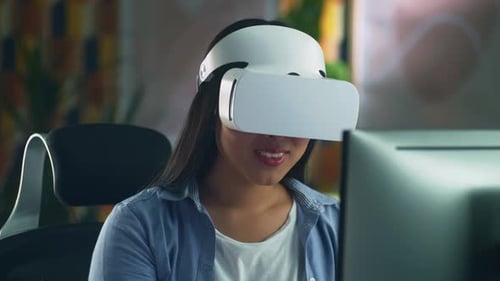 Woman Works with VR Headset in Office