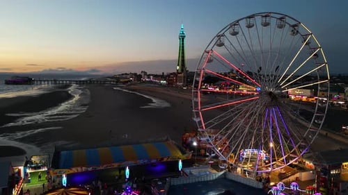 Night drone shot of The Big Wheel on the Central Pier in Blackpool city, England