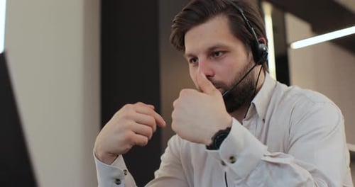 Man With Headset Talking in Office Close Up