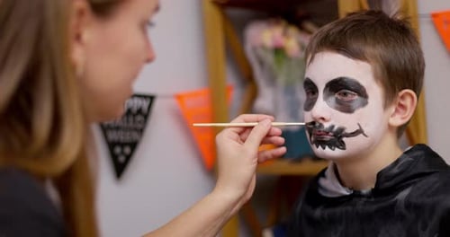 Young Boy Getting Face Painted for Halloween