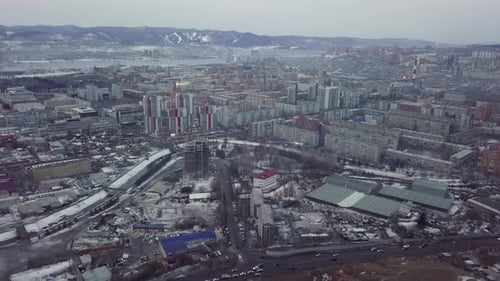 An Aerial View Showcasing the Urban Landscape During the Winter Season with Snow Cover Stock Clip