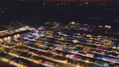 Panning Over Sunset in Bangkok Thailand and Colorful Night Market