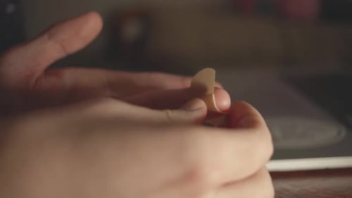 Applying a Band-aid to a Finger