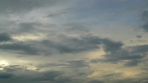 Clouds Moving Gently Across the Sky at Sunrise