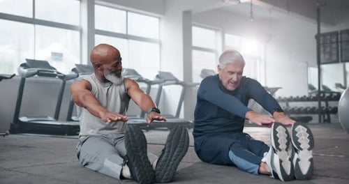 Friends, stretching and old men in gym, fitness and exercise with personal trainer