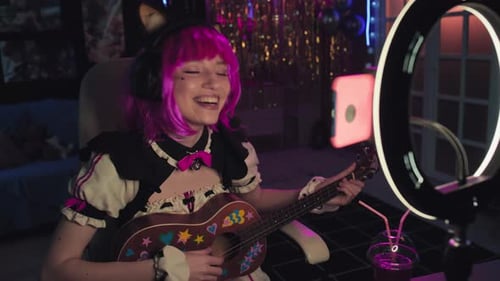 Girl with Pink Hair Playing Ukulele on Stream