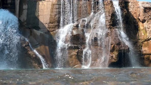 Waterfall cascade through the rocky trails in forest
