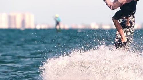 Sportsman practicing kite surf sport at the beach on a windy day at the Spanish coasts