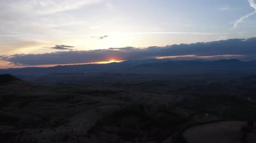 Sunset Over Mountains Clouds Aerial View