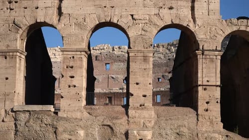 Closeup Exterior Facade of Ancient Ruined of Roman Colosseum Amphitheater on Sunny Day on Background