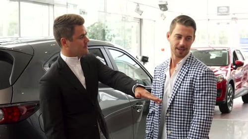 Car Dealership: Two Men Discussing Automobile Purchase