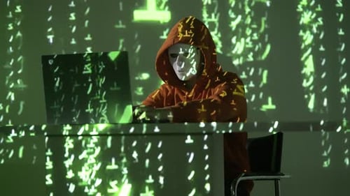 Anonymous Masked Figure Hacking in the Dark