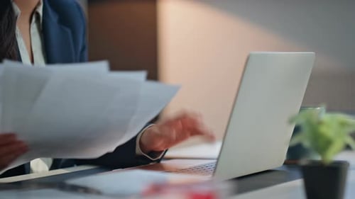 Businesswoman Working at Desk in Modern Office