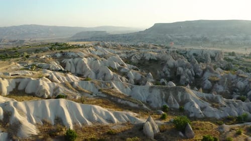 Explore Cappadocias stunning rock formations at sunrise