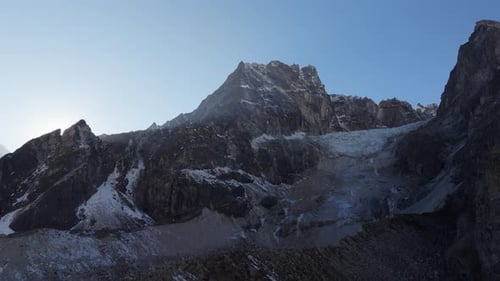 Aerial View of a Majestic Mountain Range in Nepal Featuring a Stunning Glacier and Snowcapped Peaks