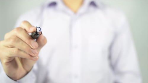 Man Writes 'Be Flexible' on Glass