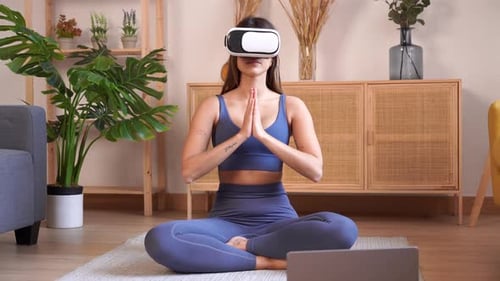 Woman Using VR Headset for Yoga Meditation