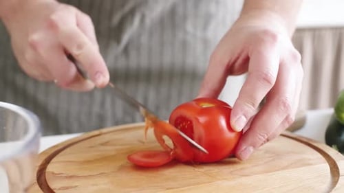 Tomato Slicing on Cutting Board Close Up