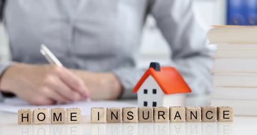 Home Insurance Concept with House and Wooden Blocks