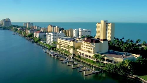 Luxury homes along naples Florida beachfront sparkle in the tropical sun