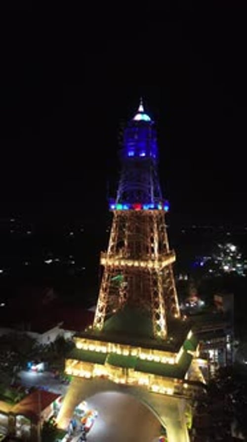 Vertical drone footage of Limboto Majesty Tower or Pakaya Tower at night