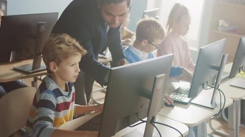 Elementary School Science Classroom: Enthusiastic Teacher Talks with a Smart Schoolboy. Using Perso