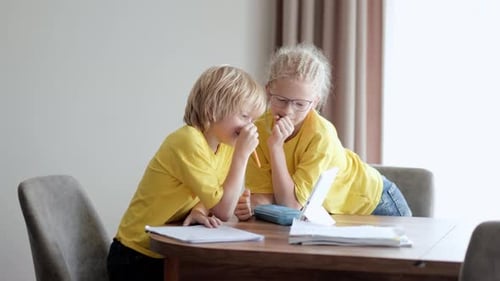 Sister Helps Little Brother Do School Homework at Home Distance Learning Online Education Boy and