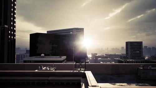 Golden Sunrise Over a City Skyline with Silhouetted Buildings in the Foreground