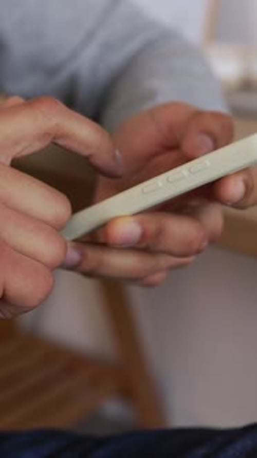 Man Interacting with Smartphone Technology Close Up