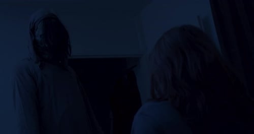 Dark Encounter with Hooded Figure Inside