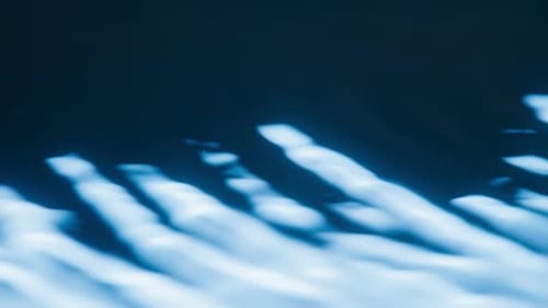 Close-up View of Dark Blue Water with White Streaks across Surface