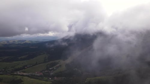 Aerial View of Mountainous Landscape with Fog