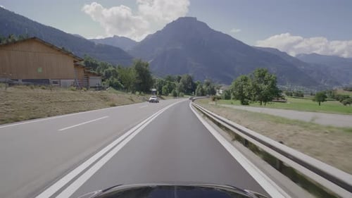 Driving on the Simplon Pass in Switzerland. The alpine landsacape filmed from the cars point of view