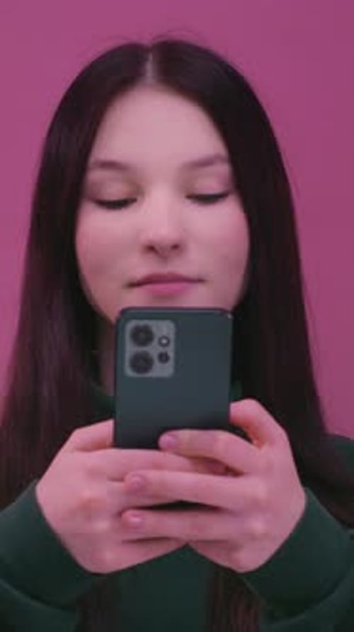 Teen Girl Holding Smartphone in Portrait Orientation