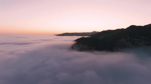 Aerial footage of beautiful mountain and clouds