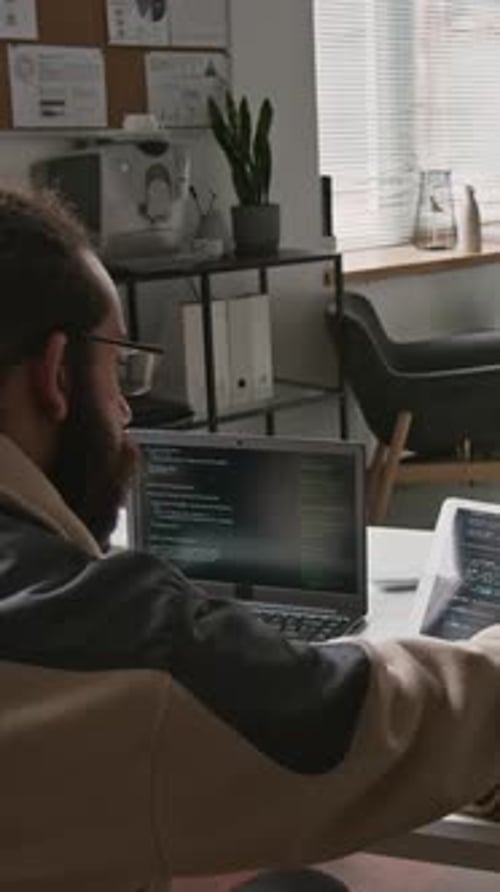 Looped Timelapse of Programmer Writing and Testing Code at IT Startup