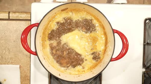 Cooking Mushroom Sauce in Pot at Home