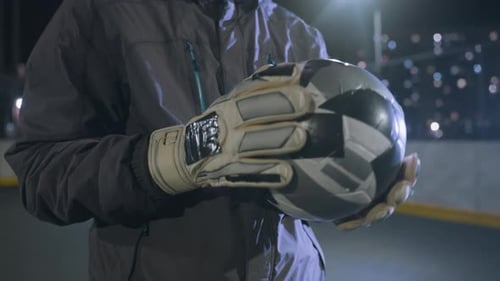 Man Holding Soccer Ball Wearing Goalie Gloves