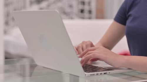 Close Up of Female Hands Typing on Laptop