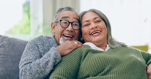 Affectionate Senior Couple Smiling Together Indoors