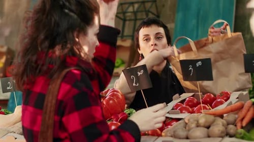 Woman Buying Fresh Produce at Outdoor Market