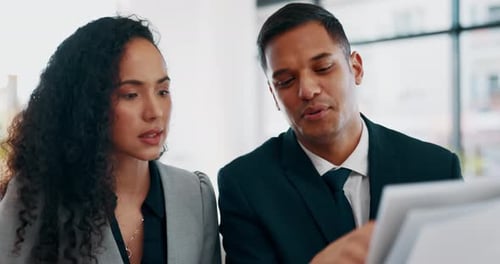 Business Colleagues Collaborating on a Project in Office
