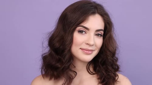 Beautiful Woman Smiling with Glamorous Makeup