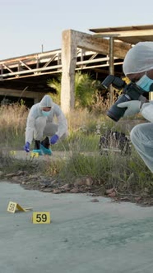 Investigators Examine Crime Scene Evidence Outdoors