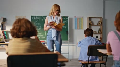 Educator Teaching Group Pupils Elementary School Woman Teacher Reading Book