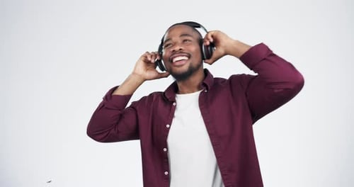 Music, headphones and black man dance in studio celebration with news, feedback